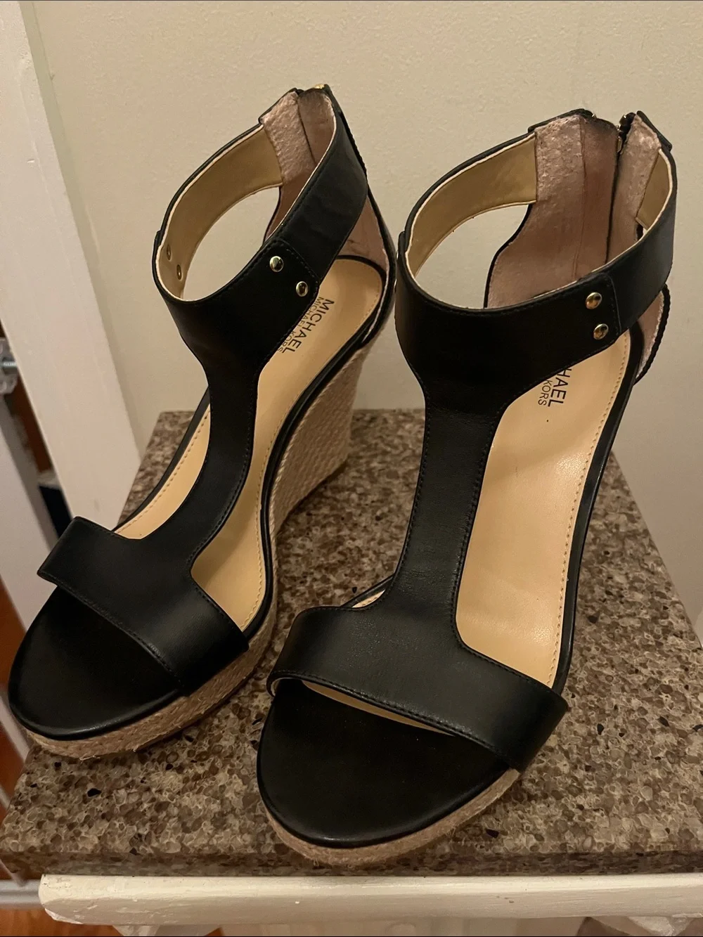 NWOT- Michael Michael Kors black leather wedge sandals. Size 7-1/2 M